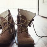 winter boots on wooden floor
