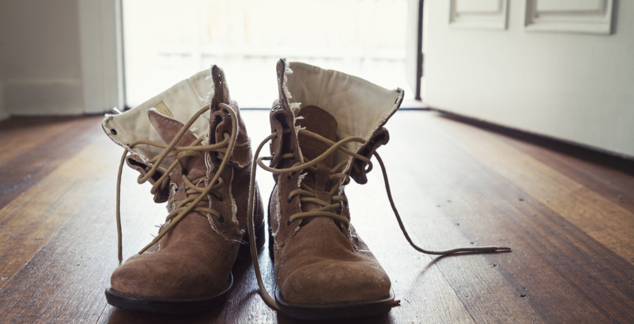 winter boots on wooden floor