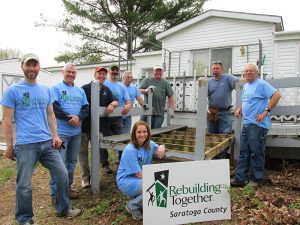 Ben and Saratoga Spring Rotary volunteer with Rebuilding Together